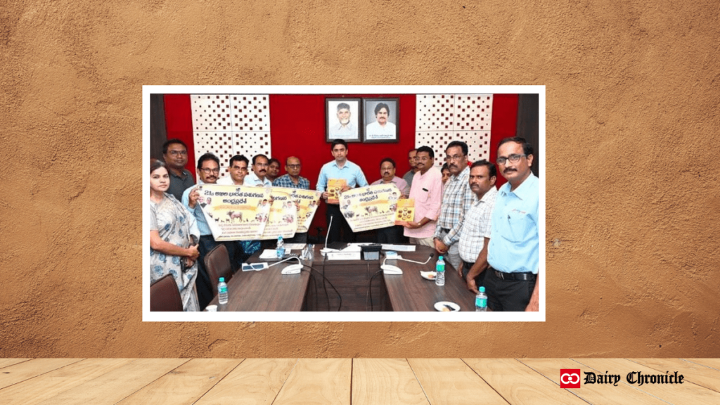 Group of people holding banners about Chittoor District Collector's dairy plan