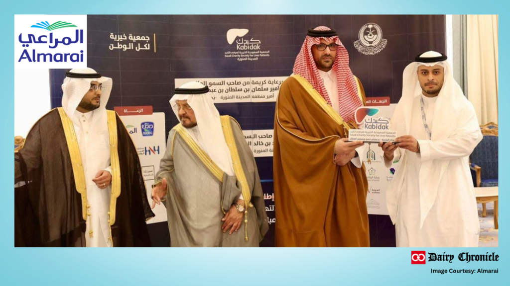 Almarai logo with company executives receiving an award