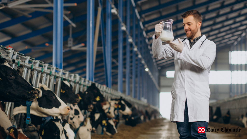 Barn with cows and a scientist researching milk with a test tube