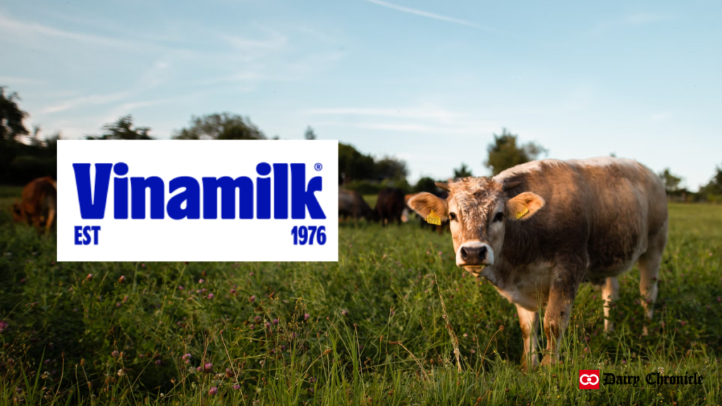 Vinamilk logo with a cow in the farm background