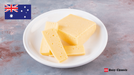 Slices of butter arranged on a plate beside the Australian flag