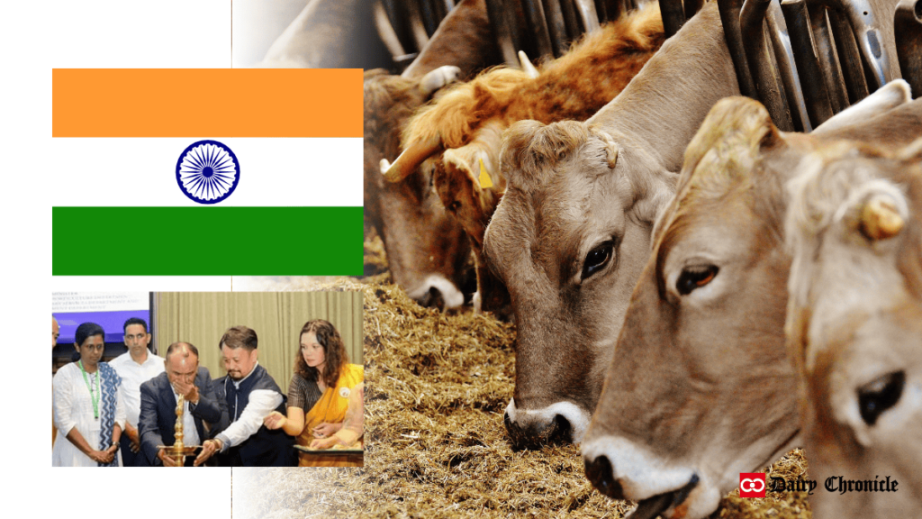 Flag of India displayed with people inaugurating, and cows grazing in the barn in the background