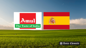 Green land with the Amul logo beside the Spain flag, symbolizing Amul’s product launch in Spain.