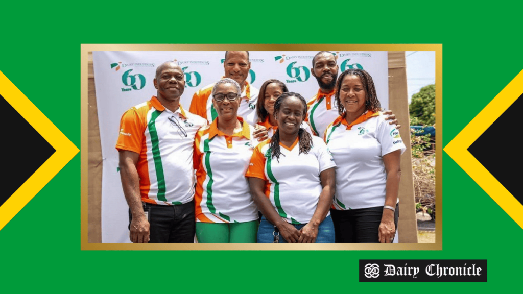 Group photo of Dairy Industries Limited team celebrating 60 years of success in Jamaica’s dairy sector.