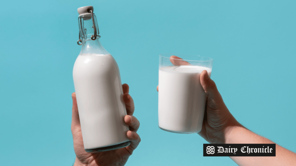 Bottle and glass filled with milk, symbolizing concerns over proposed changes to dairy contract legislation in the UK.