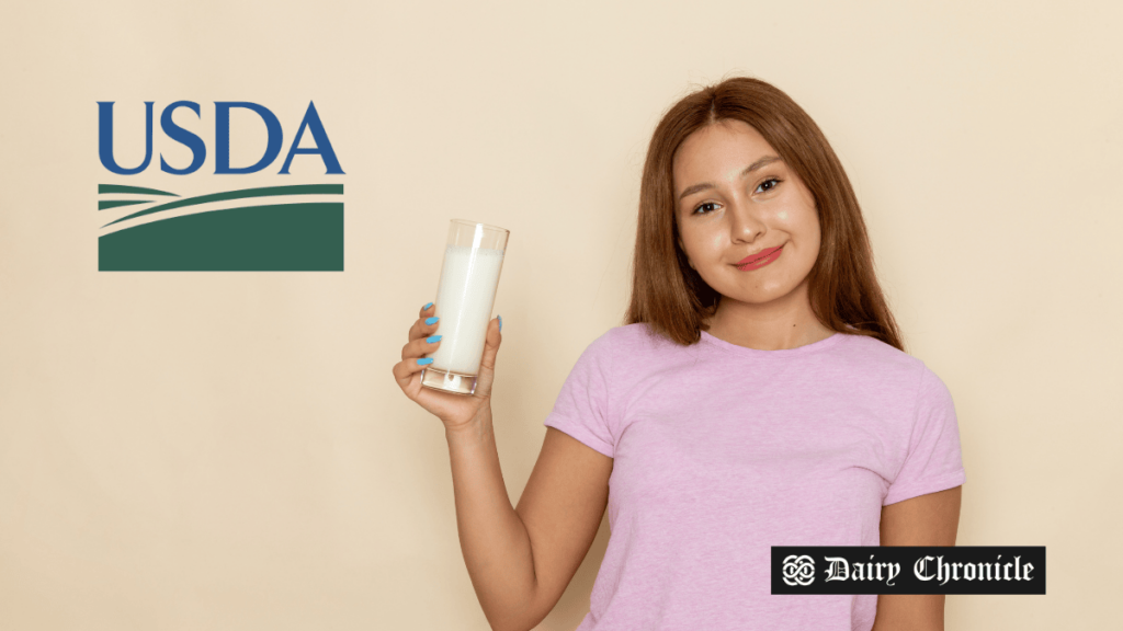 A young girl holding a glass of milk, with the USDA logo, representing the initiative to boost organic dairy in schools.