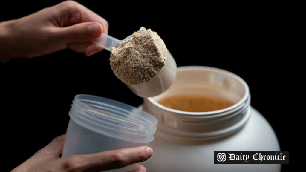 A scoop of protein powder with a container in the background, representing Arla Foods’ expansion into the U.S. protein market.