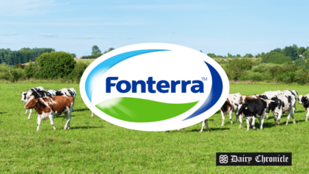 Fonterra logo with a dairy farm background, symbolizing changes in the company’s pricing model and its effect on farmers.