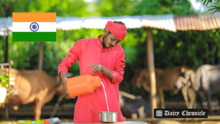 An Indian farmer pouring fresh milk into a container, representing India’s focus on dairy farming infrastructure and productivity.